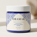 Gommage corporel ORAMAK Nila Bleue eclaircissant 200g pot transparent